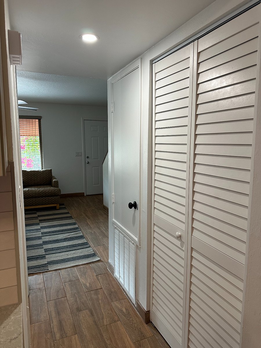 Hall separation from kitchen with large pantry.