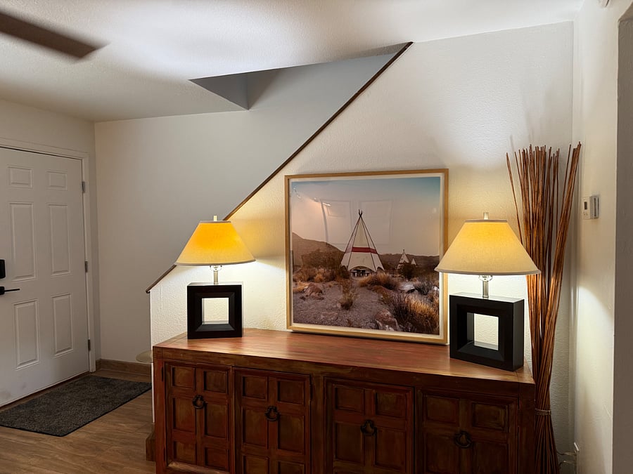 Enclosed staircase to bedrooms and full bathroom upstairs.