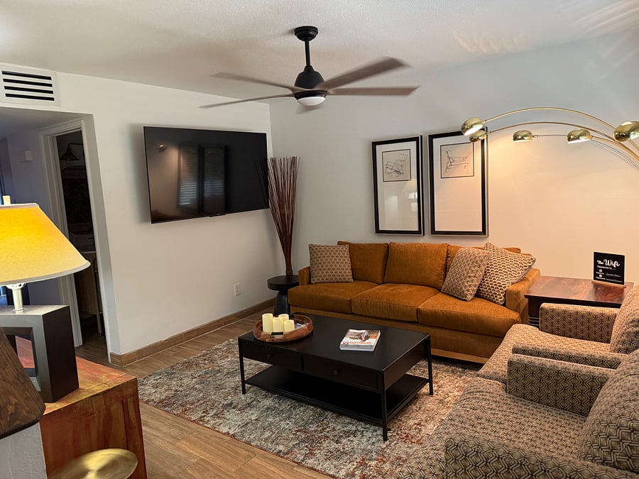 Fully furnished living room with smart tv,