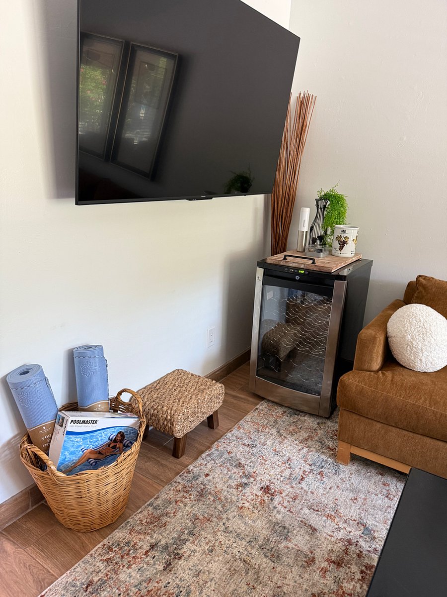 Dual Temperature Wine Cooler and a storage basket of Yoga Mats and Pool Float.