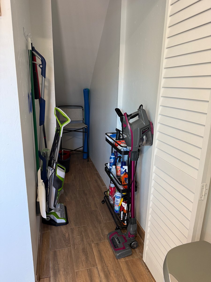 Under stairs storage with everything needed for a quick refresh. Additional bar stool for the kitchen table.