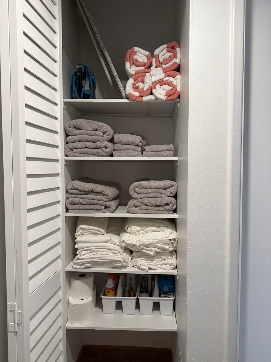 Linen closet is full of new body towels and hand towels, pool towels, extra bedding and bath accessories