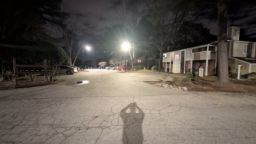Well lit parking lot - looking toward the unit.  Picture taken at night.