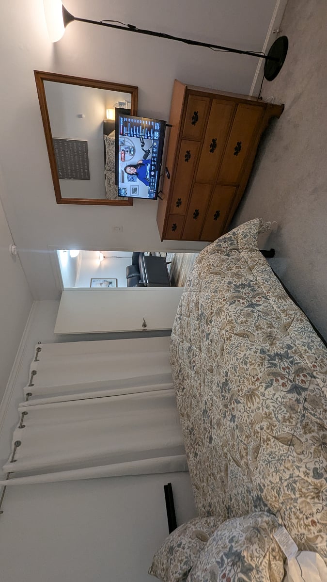 Primary Bedroom with blackout curtains for privacy and sleeping late, and Smart TV - Looking toward Den