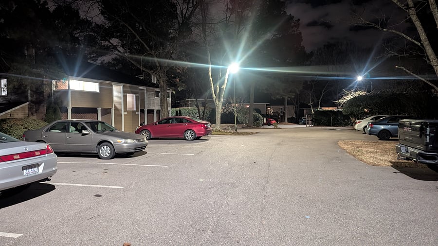Well lit parking lot - looking toward the unit.  Picture taken at night.