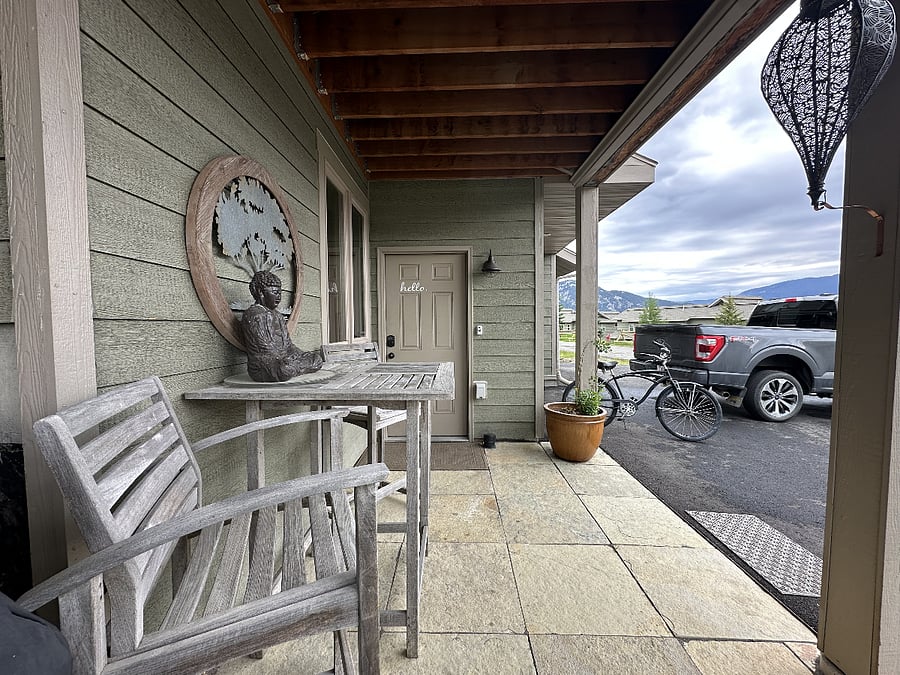 Your patio with bistro table, a Weber Propane BBQ Grill and parking just out front