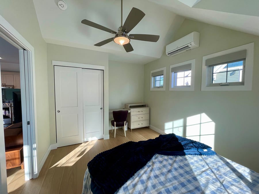 Bedroom with desk dresser combo and closet