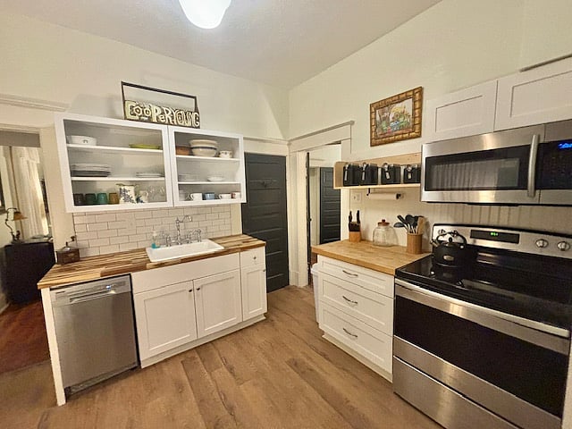 Updated kitchen fully equipped with cookware and dishes