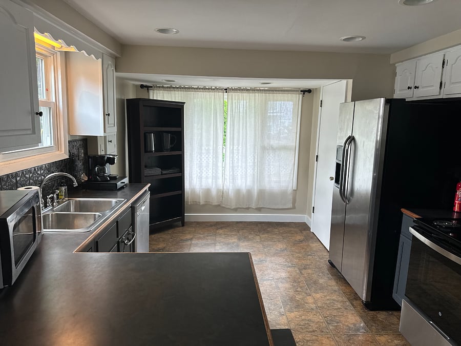 Kitchen Amenities: Microwave, toaster oven, small coffee pot, keurig, electric kettle, full refridgerator, electric stove, fire extinguisher, plates, cups, utensils, basic cooking items.