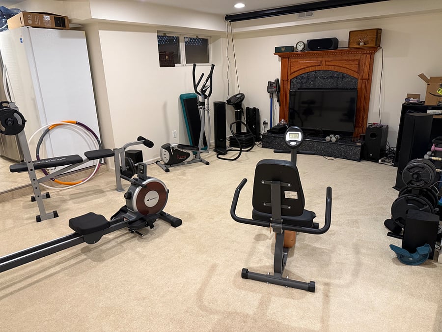 Workout room with exercise equipment, tv, weights, etc