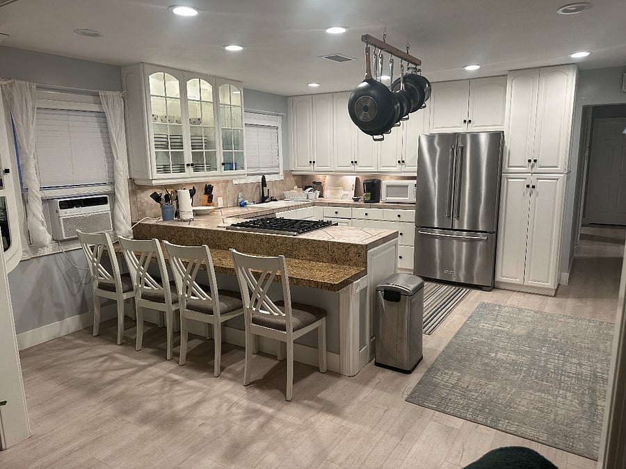 Full gourmet kitchen, dishwasher, microwave and refrigerator with ice maker. 