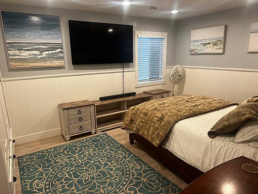 Master bedroom includes television. 