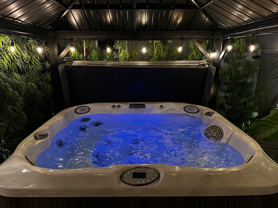 The cottage has a hot tub on the patio. 