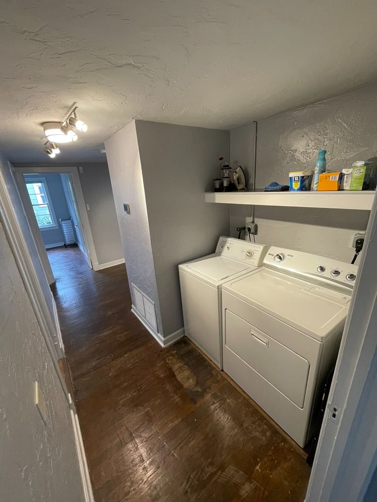 hallway with washer and dryer