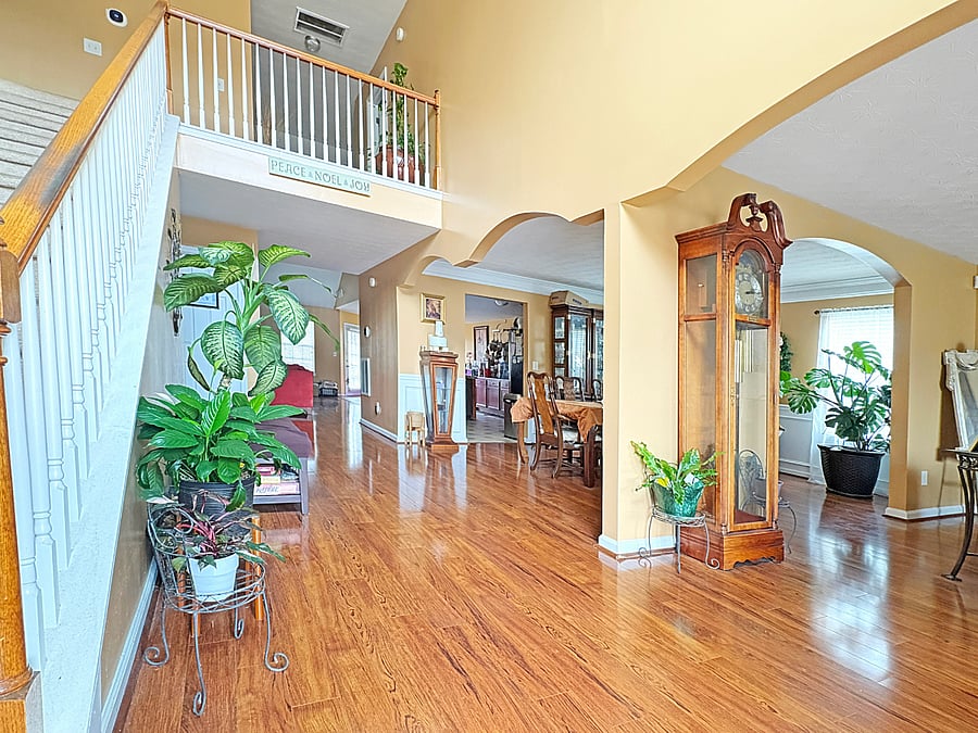 Open Foyer upon entry from the front door.  All exterior doors have a glass 'screen' door.  This available bedroom is up the stairs and to the left!