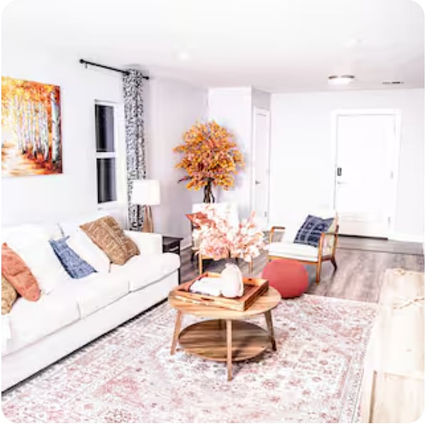 Enjoy a 65" smart TV and dedicated workspace in a quiet atmosphere with modern furnishings and decor.