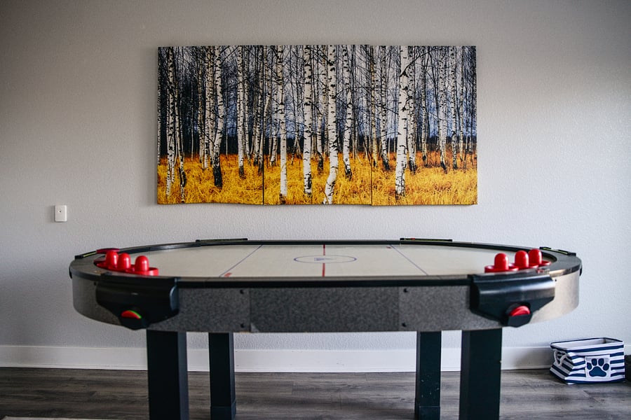 Play a friendly game of air hockey in the entertainment area with views of the outdoors.