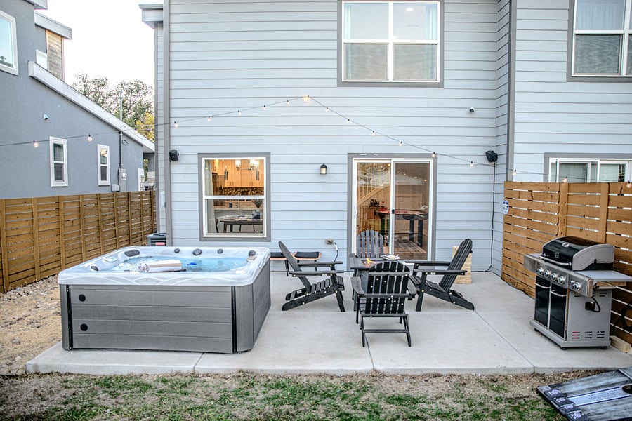 The private spacious backyard has plenty of ways to rejuvenate or play with kids. Professionally maintained hot tub.