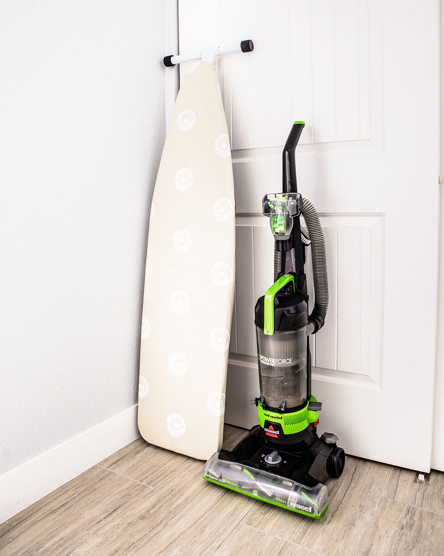 Stand alone ironing board and upright vacuum cleaner. Includes clothes steamer, spray mop.
