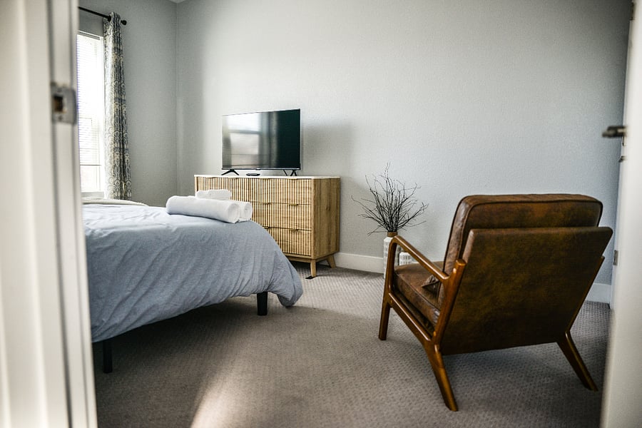 Enjoy the spacious Guest King bedroom while watching your favorite show.