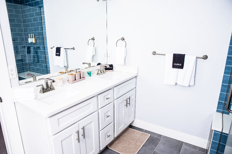 Master King bedroom en suite bathroom with double sink vanity, make-up towels, hair dryer.