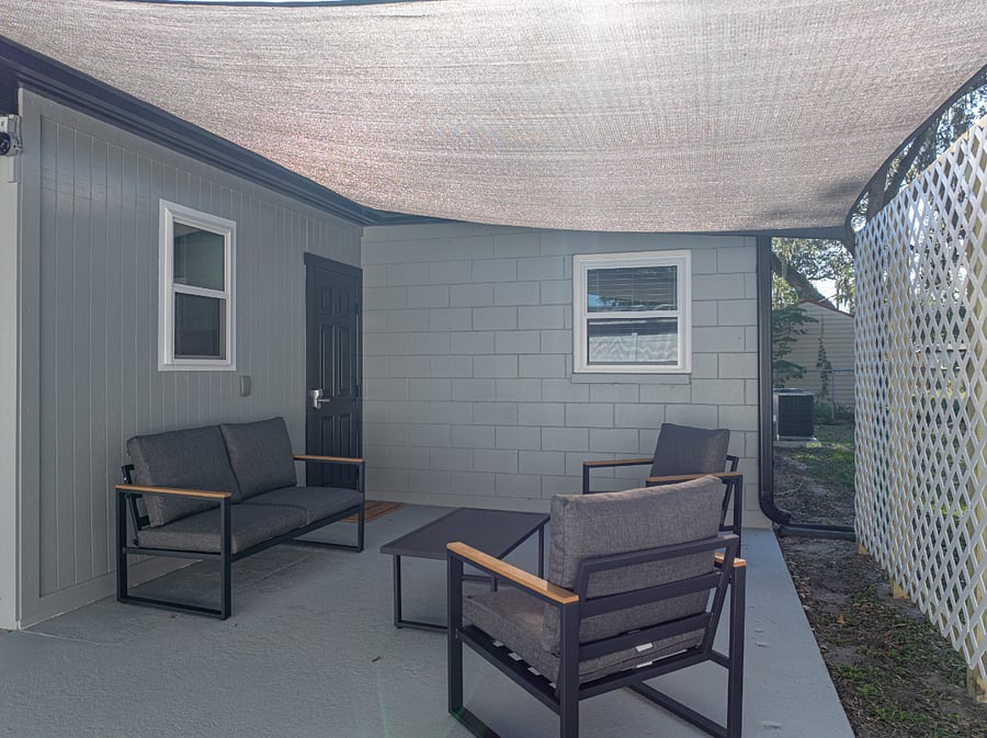 Step outside to your own private, shaded patio with seating and a grill everything you need for a relaxing meal outdoors. Grill utensils are conveniently provided inside the home.
