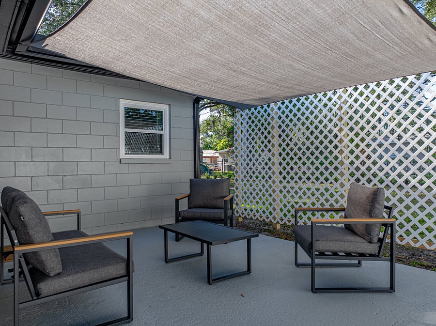 Step outside to your own private, shaded patio with seating and a grill everything you need for a relaxing meal outdoors. Grill utensils are conveniently provided inside the home.