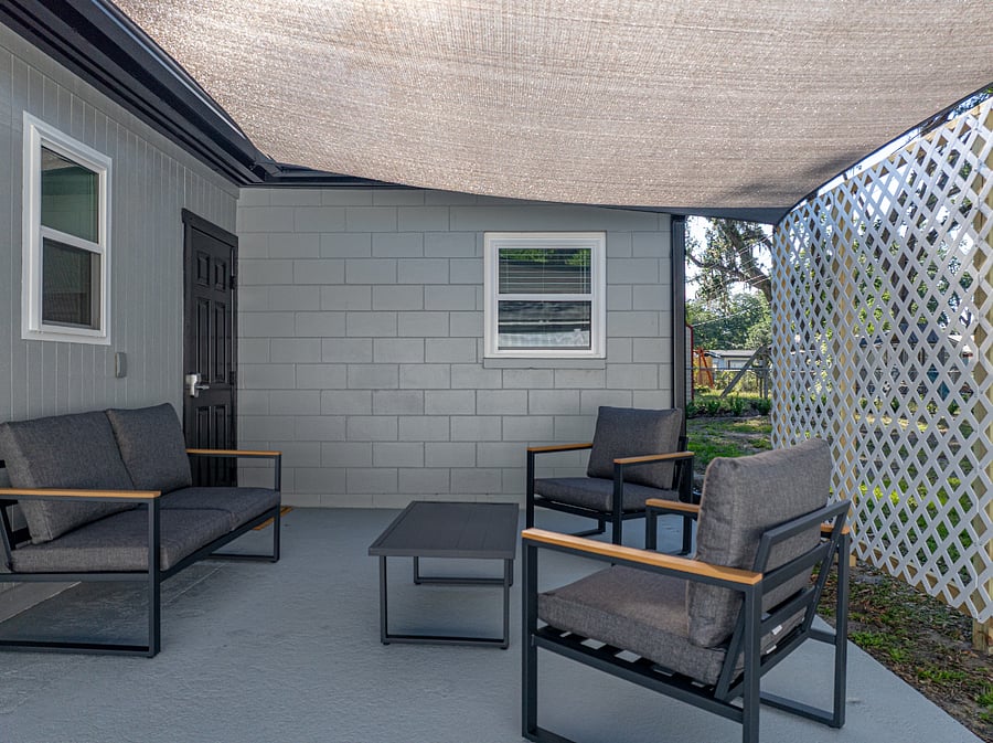 Step outside to your own private, shaded patio with seating and a grill everything you need for a relaxing meal outdoors. Grill utensils are conveniently provided inside the home.