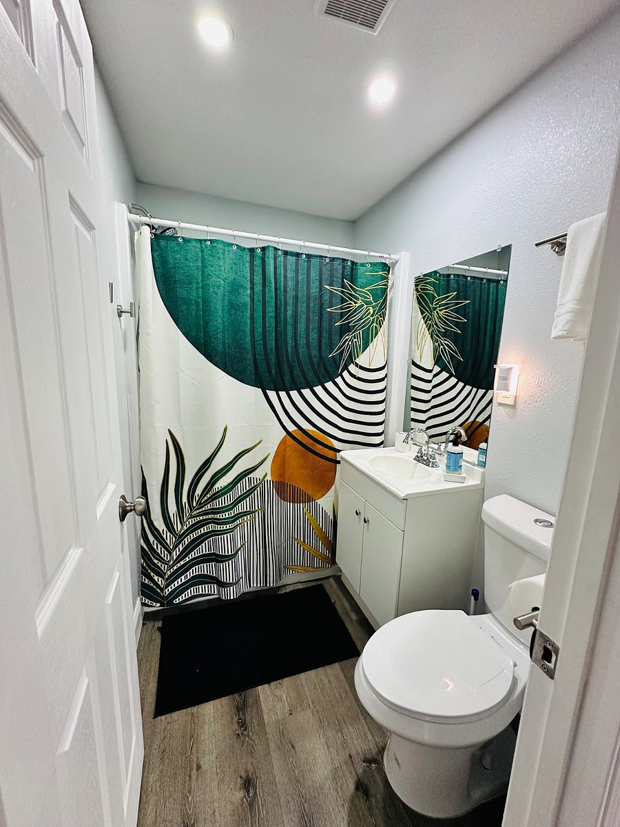 Our inviting main bathroom offers a relaxing tub, perfect for unwinding after a busy day. Thoughtfully designed with modern touches, its equipped with all the essentials to make your stay comfortable and convenient!