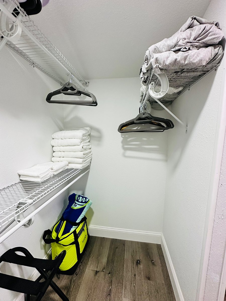 Our master walk-in closet is here to make your stay stress-free! Youll find beach towels for fun days, extra bath towels, cozy pillows, soft sheets, warm blankets, an ironing board, & fans-all thoughtfully provided for your comfort and convenience!