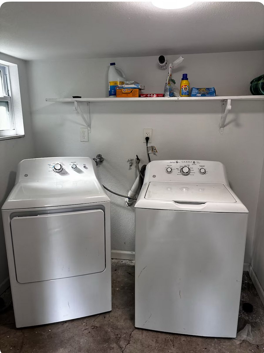 The laundry room, located in the backyard of this 100-year-old home, adds to its historic charm. Please keep the door closed to help keep critters out. Laundry baskets are provided in the master bedroom for convenient carrying.