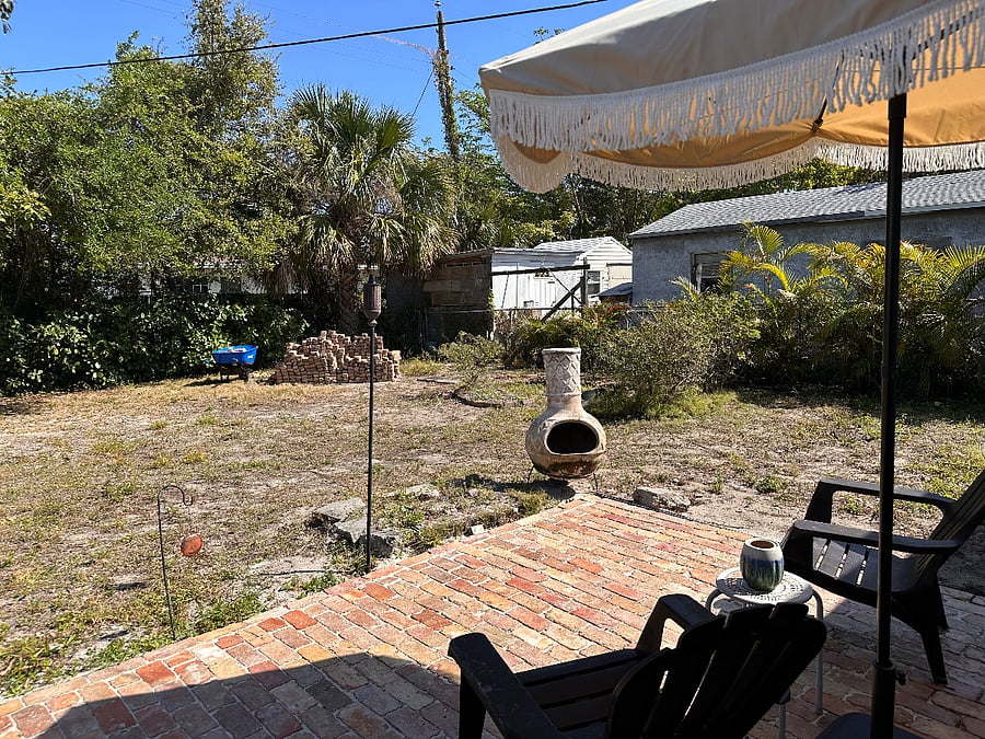 Not the best backyard but there is a little patio to hangout, and a very productive starfruit tree, too! Help yourself.