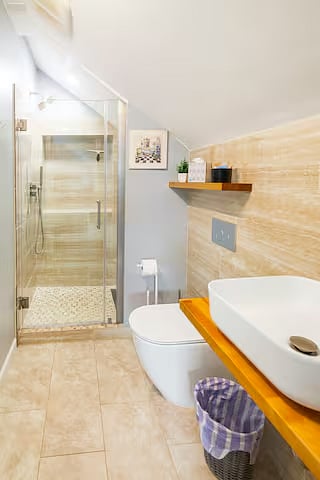 Full bathroom with very comfortable rain shower.