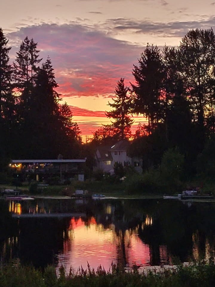 View of the lake below at sunset.