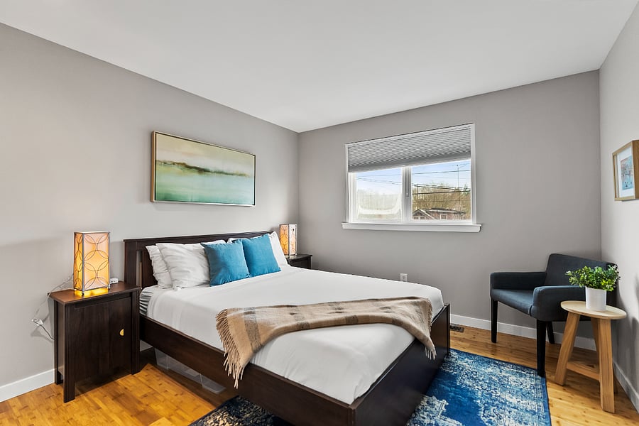 Second bedroom with queen bed and reading corner