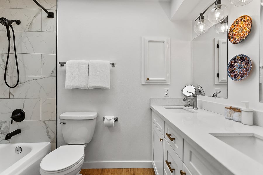 Primary bathroom with dual sinks and full bathtub. This is an en-suite bath off the primary bedroom