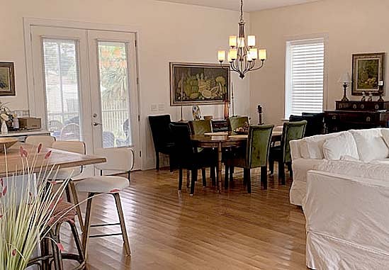 dining area with double doors to screened-in porch