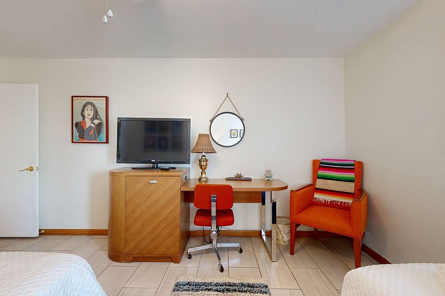 Second bedroom features not only a desk but a tribute to Corpus Christi icon Selena