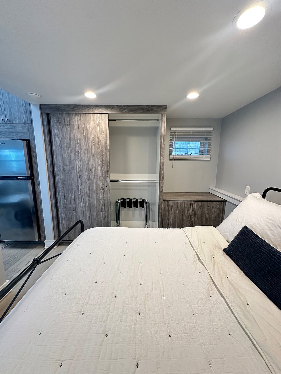 Bedroom closet and window.