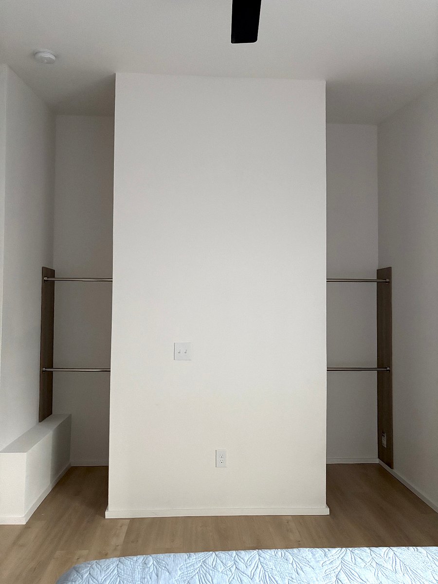 Behind wall walk-in closet