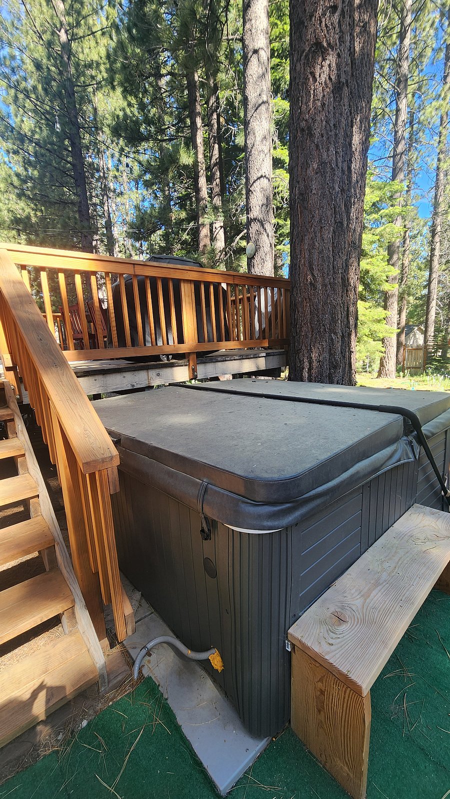 Hottub in backyard with deck