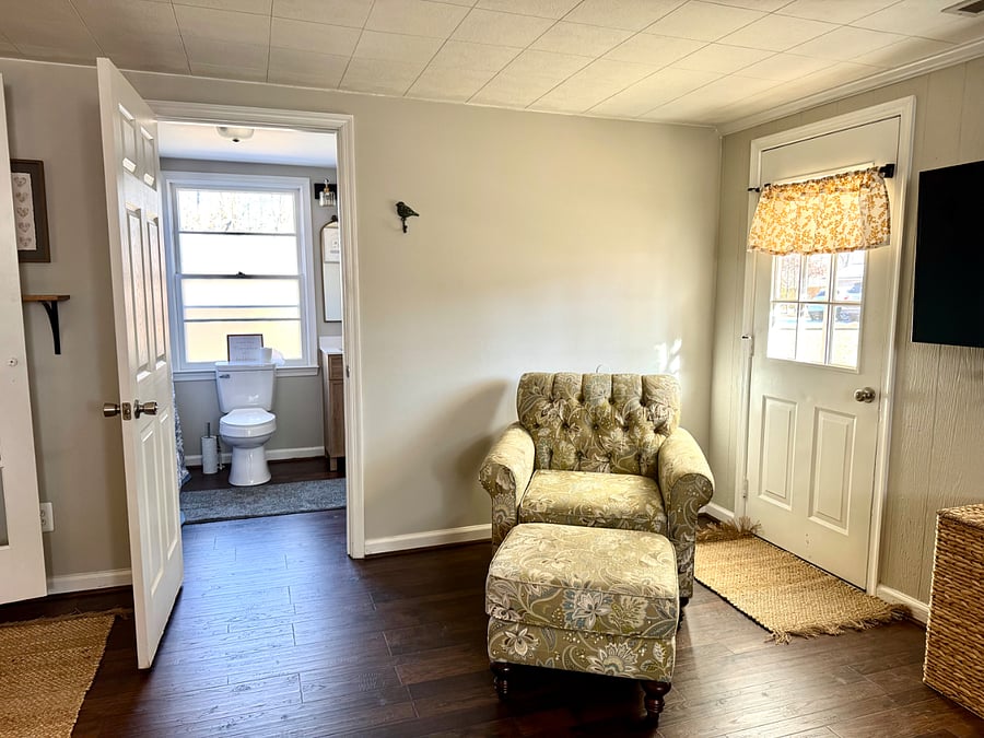 Seating area- main bedroom. View to en-suite bathroom