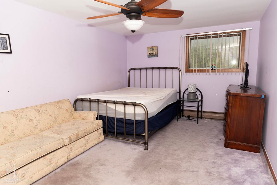 Large room with Queen-size Bed, with large storage closet, Smart TV, and couch with pull-out bed.