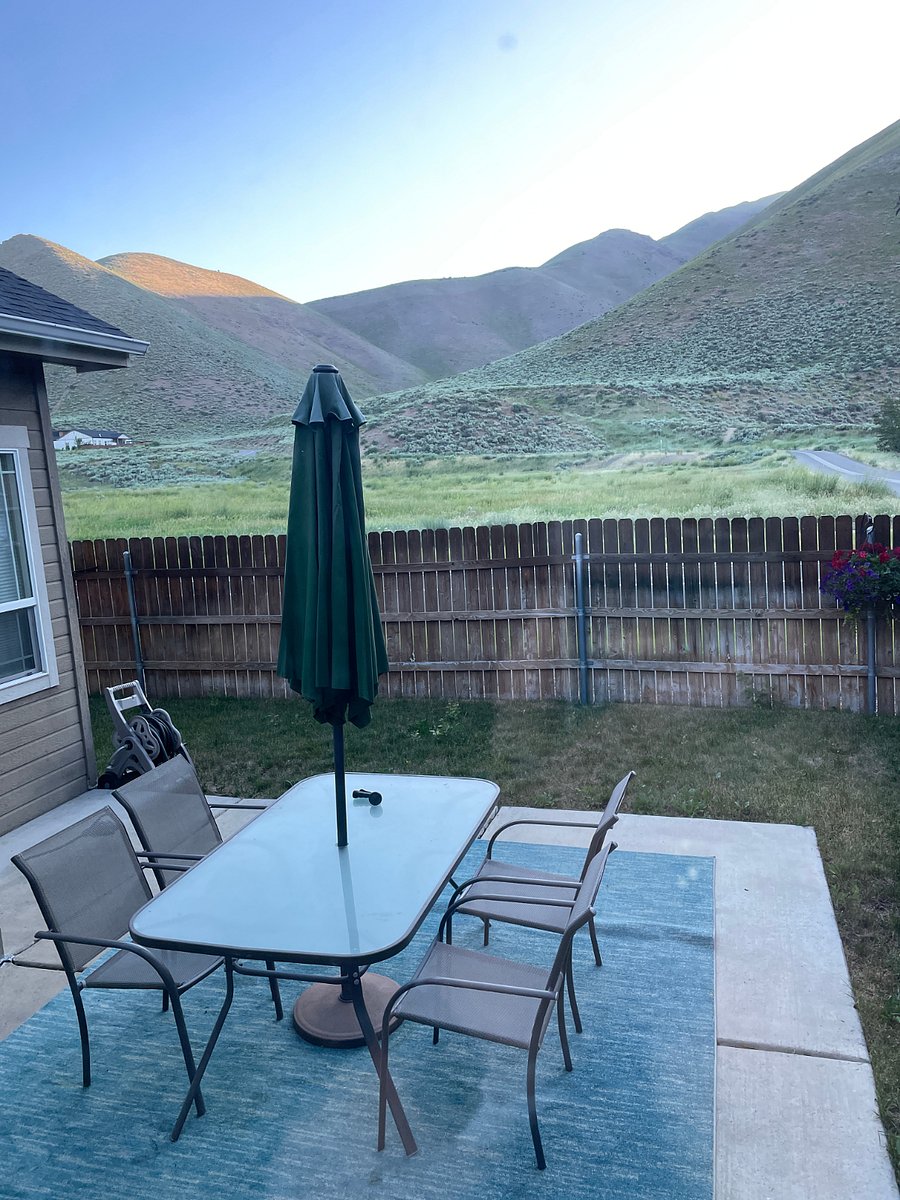 Backyard patio with fully fenced yard