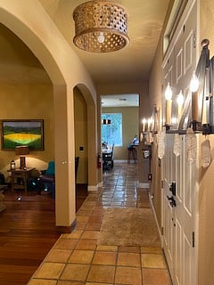 Enter front door
Hallway to kitchen/dining/living great room on right side wing of the home