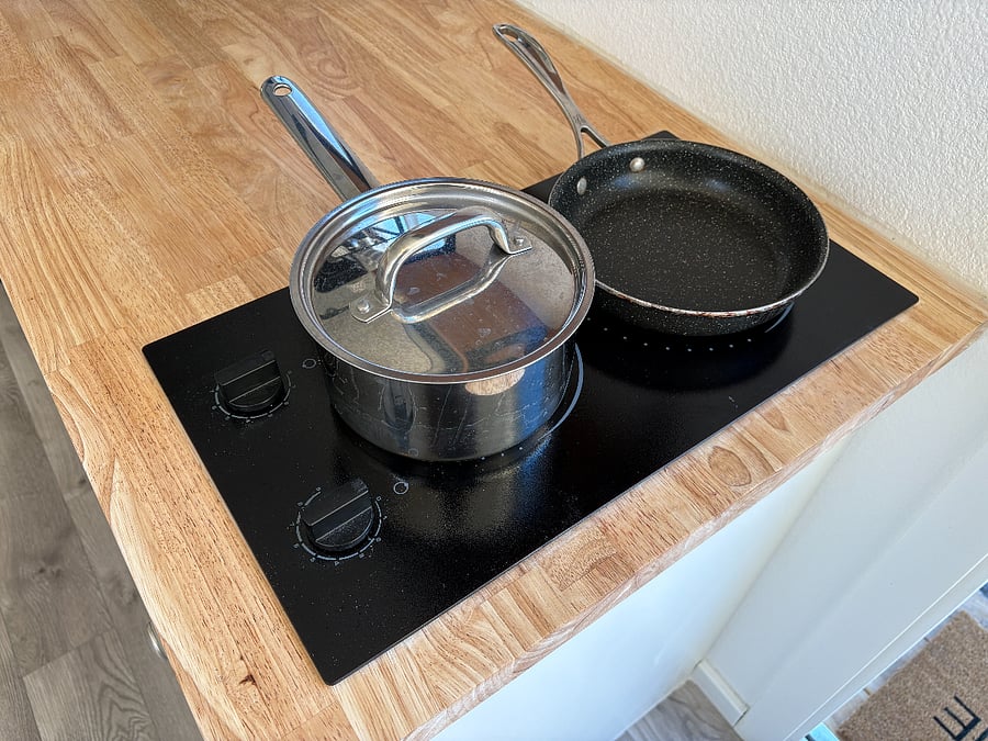 New electric cooktop burners. Pot & pan included.