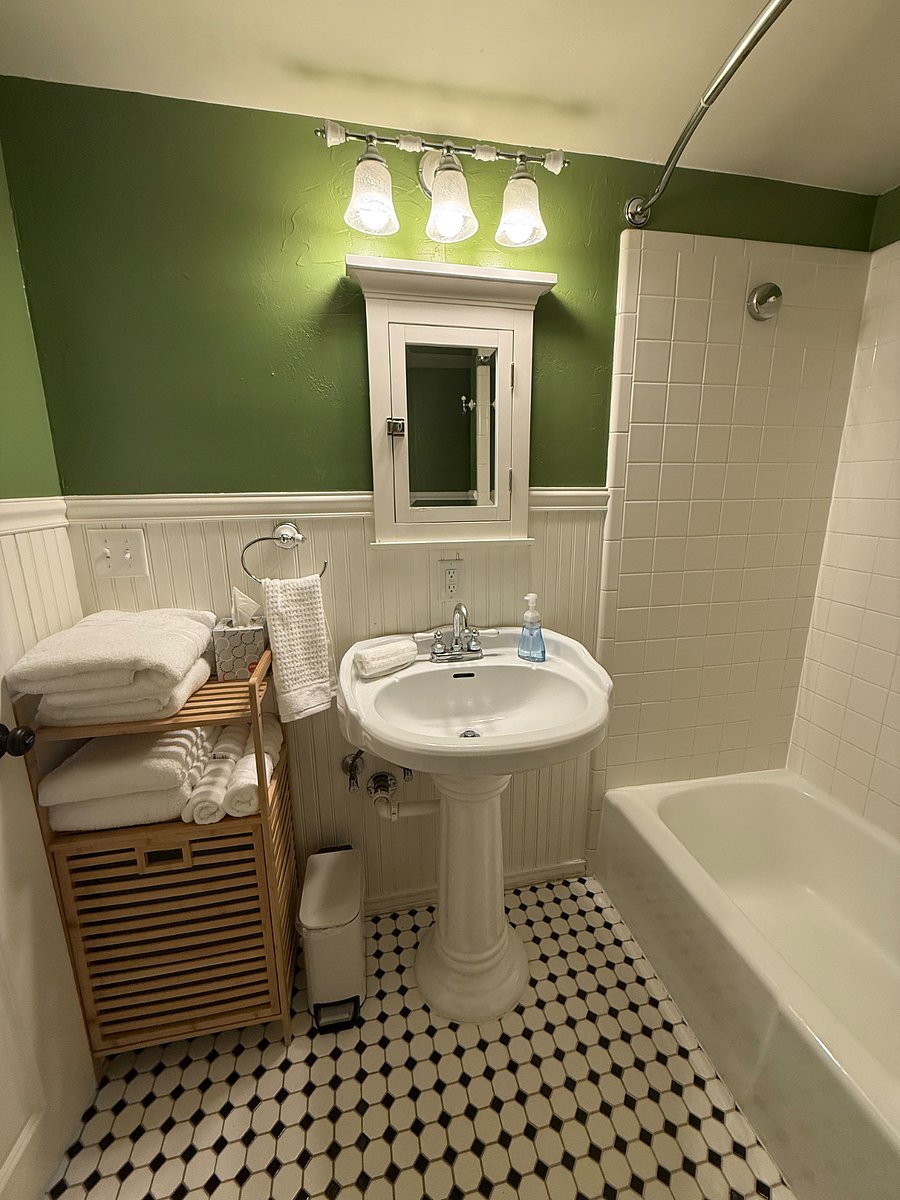 Full bathroom with bathtub.