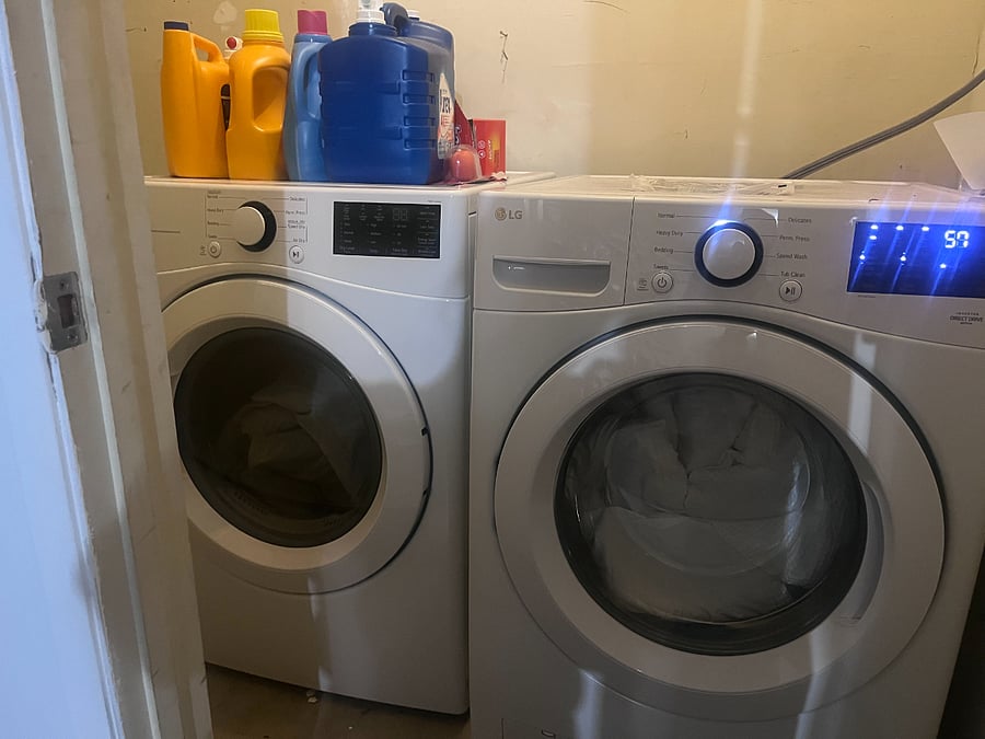 Shared washer and dryer, accessed from garage.