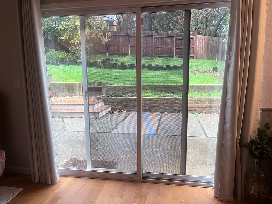 Sliding doors to backyard. Lockable from inside only.