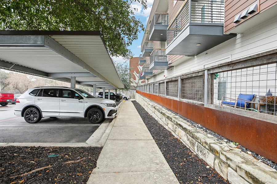 Exterior of condo community with lots of guest parking